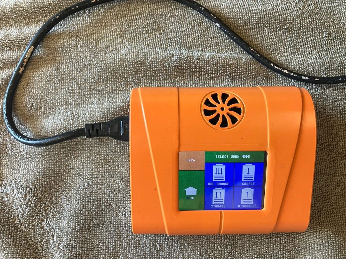 The older orange JETSURF multi-chemistry balance charger, its touchscreen showing LiPo and the Bal. Charge, Charge, Storage and Discharge modes